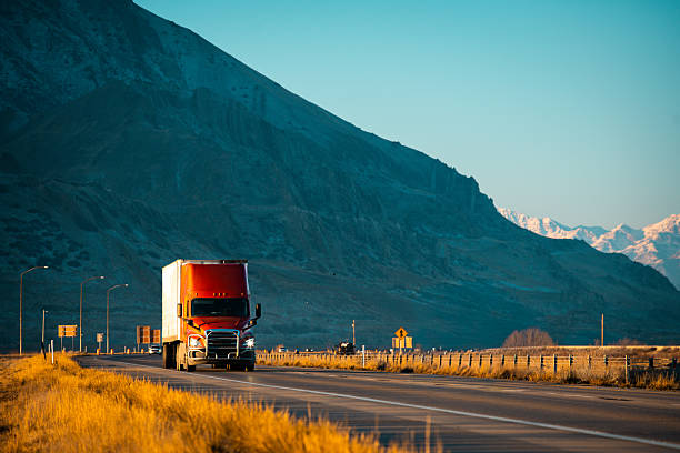 istock A Red Semi-Truck Is Speeding Down A Four-Lane Highway 2257296668