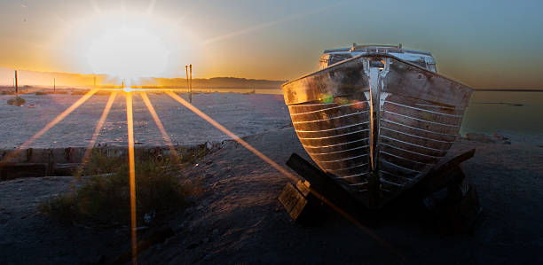 An abandoned boat on the shore of the Salton Sea in California.