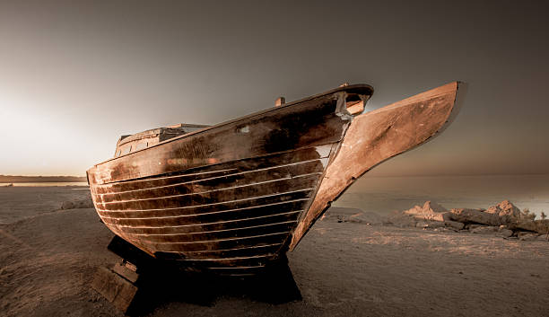An abandoned boat on the shore of the Salton Sea in California.