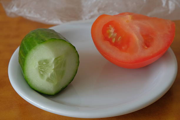 various vegetables on a white background and plate tomatoes cucumbers shown twisting products in a circle healthy eating 1