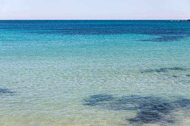 Summer vibes over Ionian Sea and rocky coastline in Lecce province, South Italy
