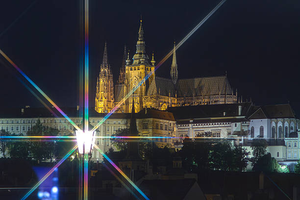 Prague at night. Retro style with rays of light. Czech Republic