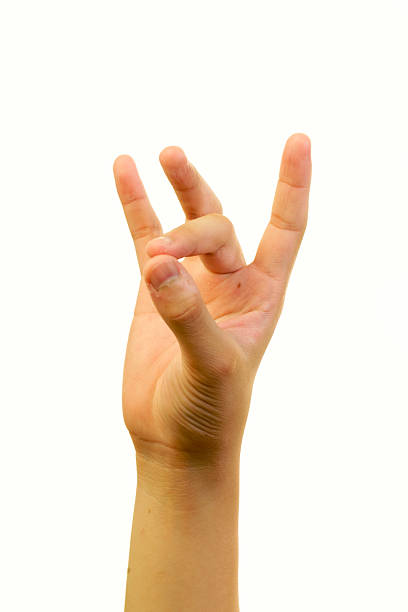 Hand Gesture of Rock Sign with Isolated Background in Bright Light