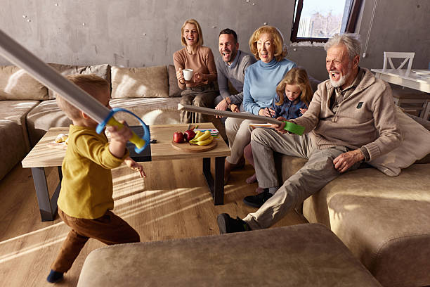 Happy multi-generation family having fun in the living room.