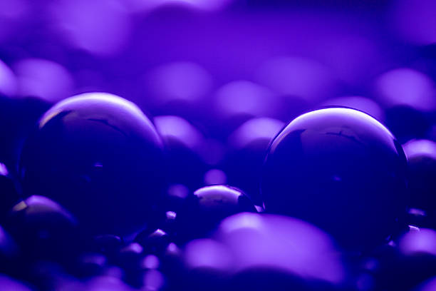 A large number of small purple spheres, arranged in a pattern that resembles a face. Scene is one of calmness and serenity, as the spheres seem to be floating in a peaceful, tranquil environment