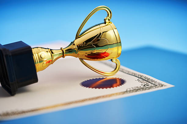 gold trophy on the blank certificate
