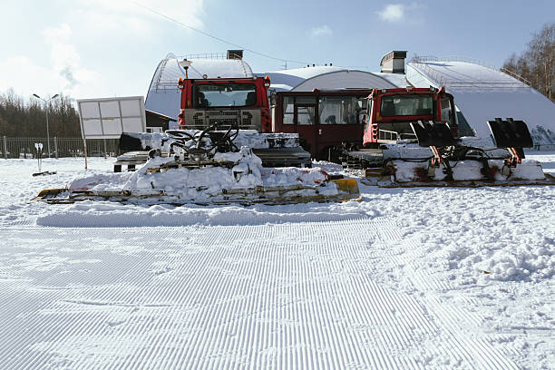 Wengen Switzerland, Switzerland – January 11, 2024: A Pistenbully grooming slopes on a sunny day in Switzerland, Bernese Oberland