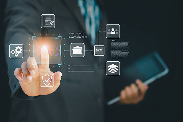 istock Business professional interacting with a futuristic AI interface, showcasing data management and workflow automation through digital icons and holographic displays in a modern office setting. 2257384249