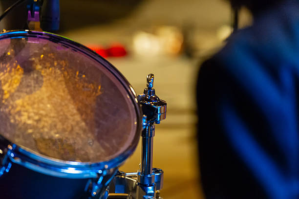 A drum kit drum during a concert against a blurred background. Web banner. For design.