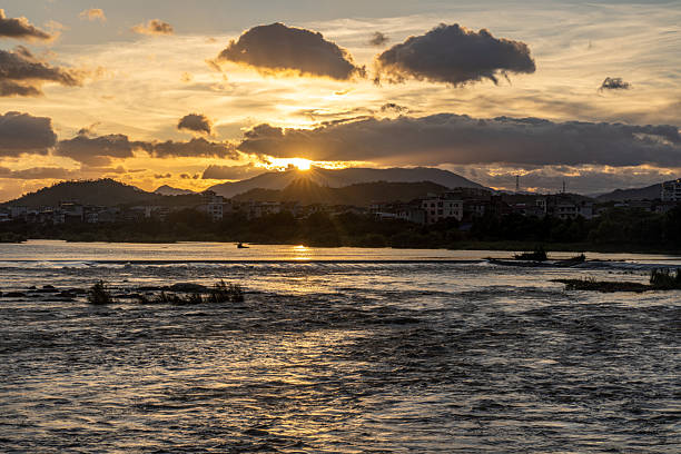 The turbulent and murky stream at dusk