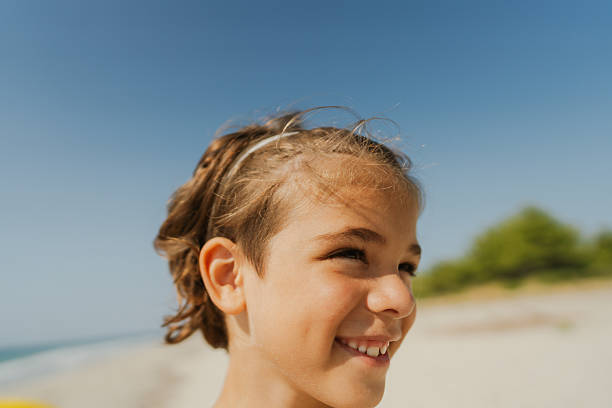 Photo of a young boy spending summer days by the ocean