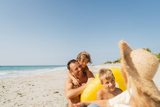 Grandfather carrying boy on his shoulders at the beach, Hollywood Beach, Florida, USA