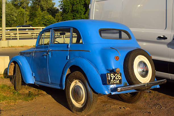 Vintage blue Soviet-era passenger car parked outdoors on a city street. Everyday urban scene with classic automobile reflecting historical design and automotive culture of the Soviet period - June 20, 2021, Saint Petersburg, Russia