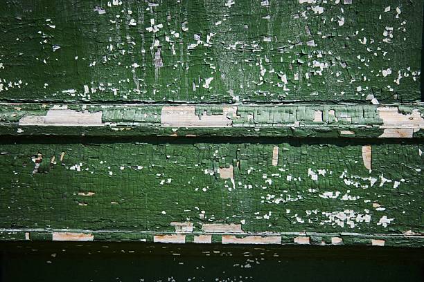 The old scratched wooden surface is green