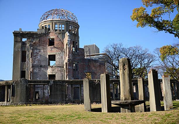 Hiroshima, Japan - A tourist photographing the Atomic Bomb Dome building, part of the Hiroshima Peace Memorial in the city centre.