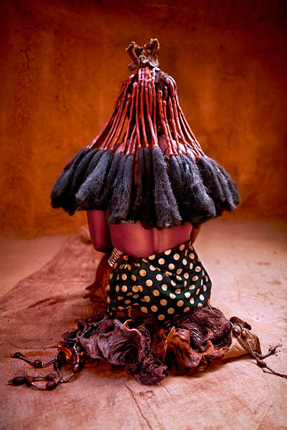 Himba woman displaying her distinctive erembe hairstyle and traditional attire