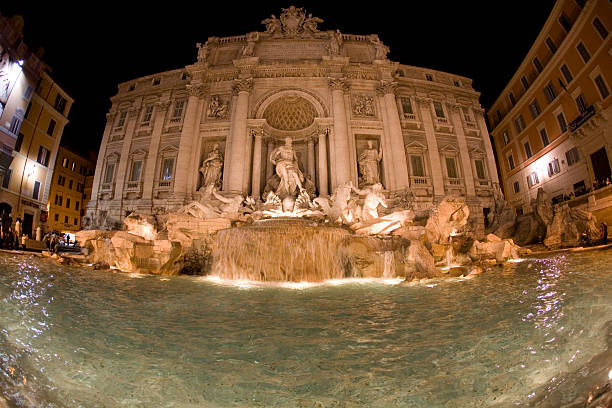 Italy, Rome - November 26, 2023: Baroque Trevi Fountain illuminated at night. Architect Nicolo Salvi, Rome, Italy