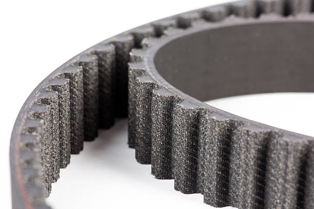 macro photograph of a car transmission timing belt on white background