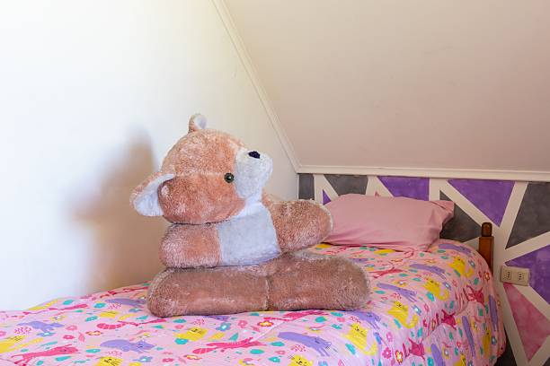 large stuffed animal on the bed