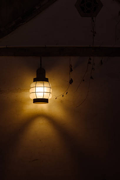 istock A Glowing Kerosene Lantern on the Wall 2257503019
