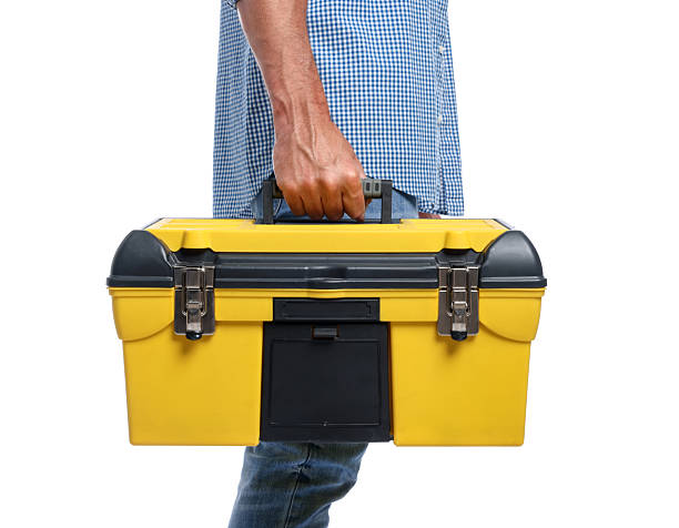 Professional repairman with tool box on white background, closeup