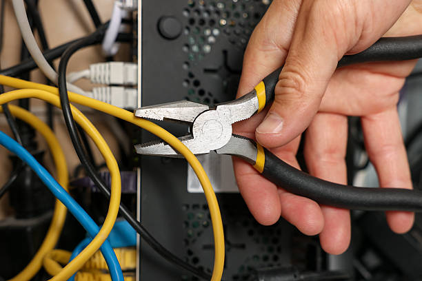 istock Man fixing heating radiator with pliers indoors, closeup 2257505930