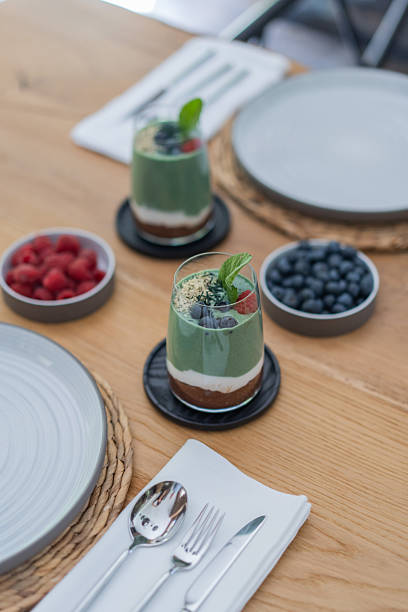 Vegan breakfast smoothie and berries on table
