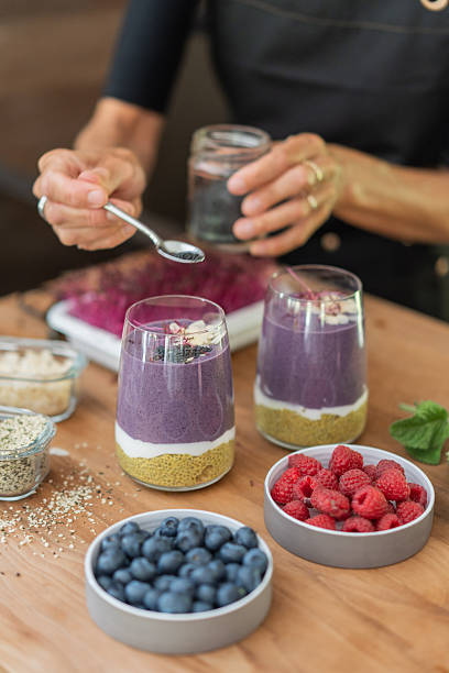 Young woman prepares healthy vegan breakfast