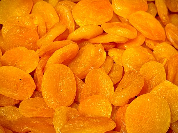 ripe apricots with leaves isolated on white background