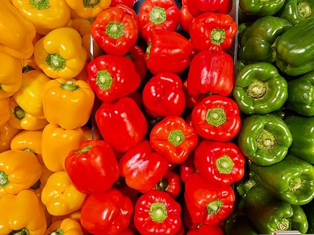 Selling fresh groceries pepper  at market of Scarborough near York England UK