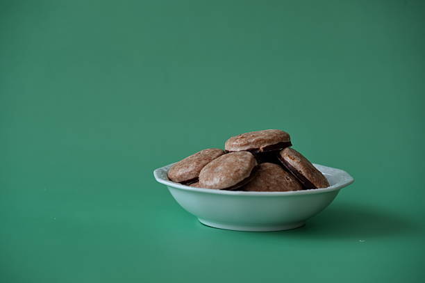 Cookies in a bowl against green background