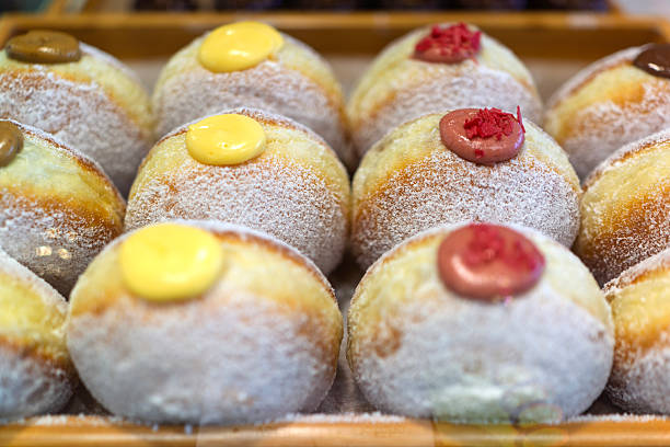 Assorted Cream-Filled Donuts Displayed in Bakery Tray