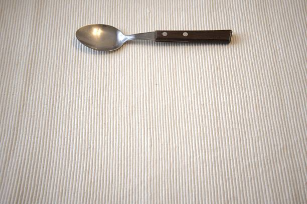 Old teaspoon isolated on white background.