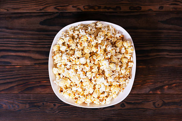 Lots of cheese and sweet flavored popcorn background.