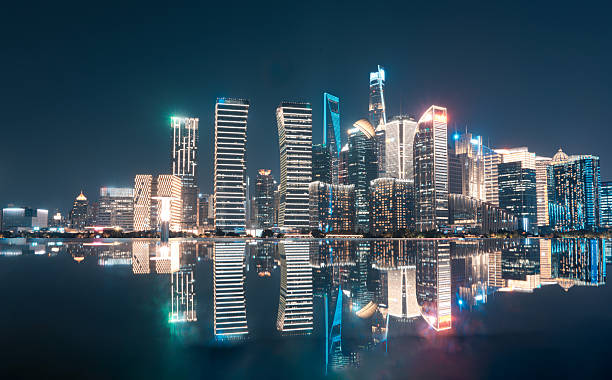 istock Spectacular City Skyline Mirrors Perfectly on Calm Night River 2257535997