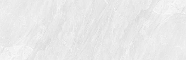 Elegant light gray marble texture background with soft natural stone veining.