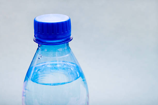 istock Plastic bottle of pure drinking mineral water on a light background. 2257546398