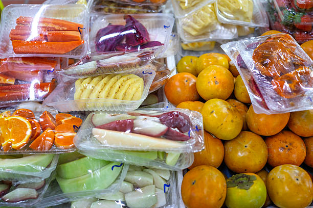 Freshly Cut Tropical Fruits Packaged for Sale at Local Market Stall