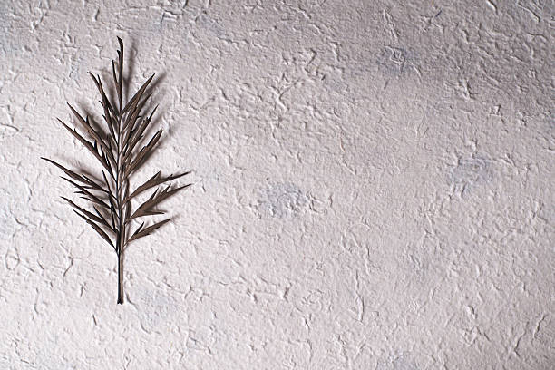 Paper with light yellow flecks and natural fibers for textured backgrounds