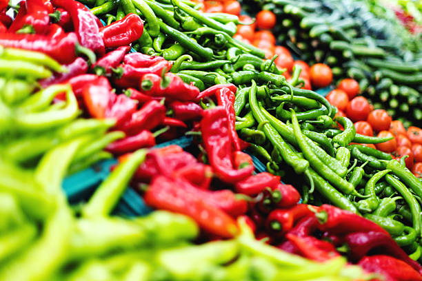 Red and green bell pepper at the grocery counter