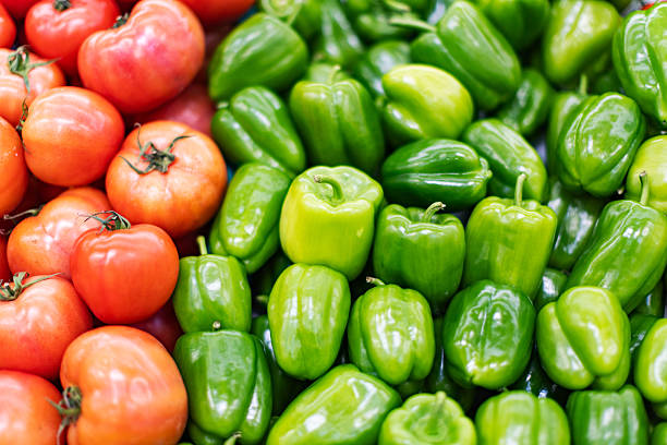 Bell pepper and tomato at grocery shelves