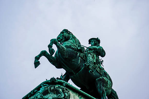 Low-angle photograph of a monumental bronze equestrian statue set against an open sky. The image conveys strength, authority, and cultural heritage, suitable for travel, tourism, education, or history-focused commercial use.