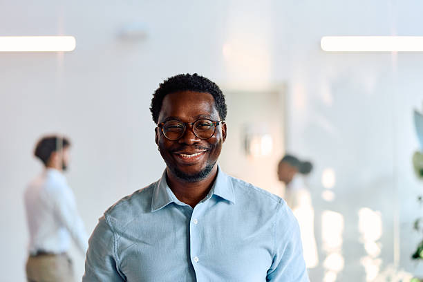 istock African American businessman smiling in modern office environment 2257575248
