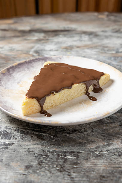 istock Slice of sweet chocolate dessert dripping down 2257576249