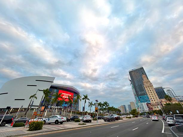 Miami, Florida, United States of America - January 10, 2026: Miami, Florida downtown street view showcasing the iconic Kaseya Center and historic Freedom Tower under a cloudy sky, illustrating urban architecture and bustling city life on NE 8th Street