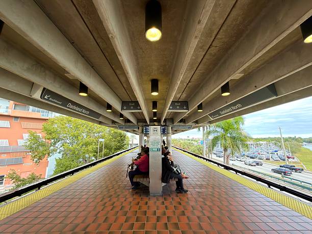 Miami, Florida, United States of America - January 10, 2026: People are waiting on the platform at the Dadeland North Metrorail station, highlighting urban transportation and connectivity in Miami, Florida for commuters and tourists