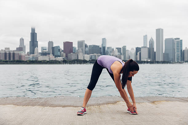 A woman running outdoors, middle aged woman in sportswear.