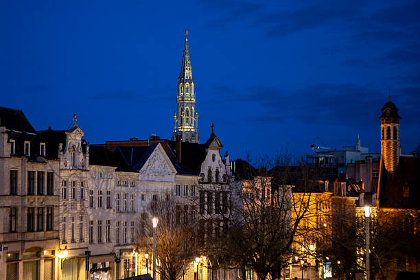 Brussels city skyline viewed from Mont des Arts just before sunrise. The tower of Brussels Town Hall can be seen on the horizon.