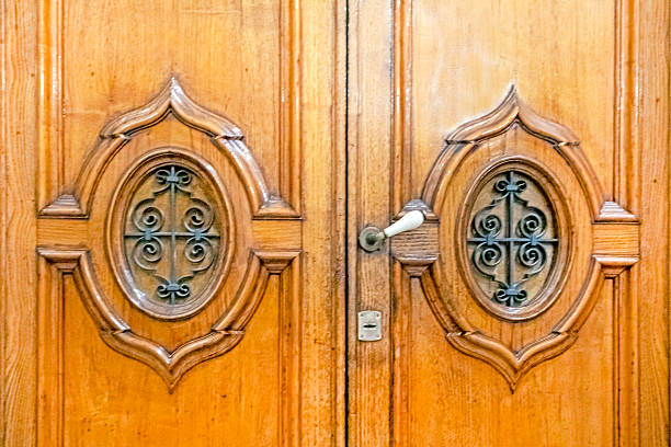 carved oak doors in Borrocco style at the entrance