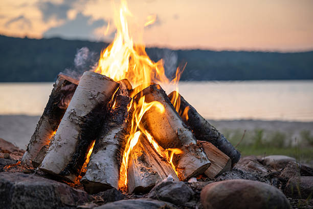 Summer Campfire and Lake at sunset filmed in super slow motion